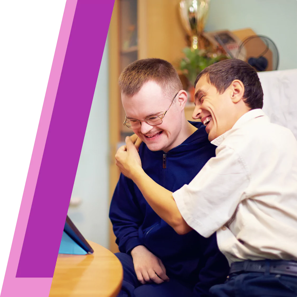 Two disabled friends laughing together